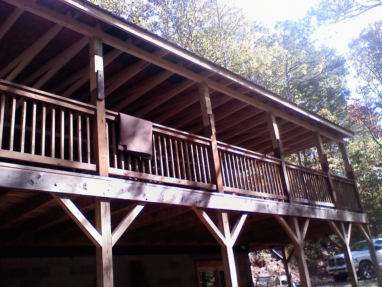 Timber framing under a new elevated porch and deck — Roof Leak Repair in Weaverville by Roofing Brothers